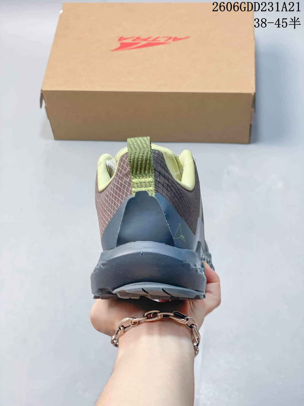 Rear view of the trail shoe showing the heel and pull tab