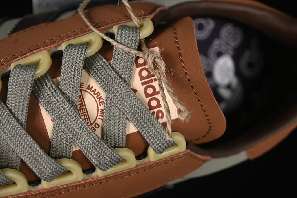 Close-up of grey laces and cream-colored lace loops