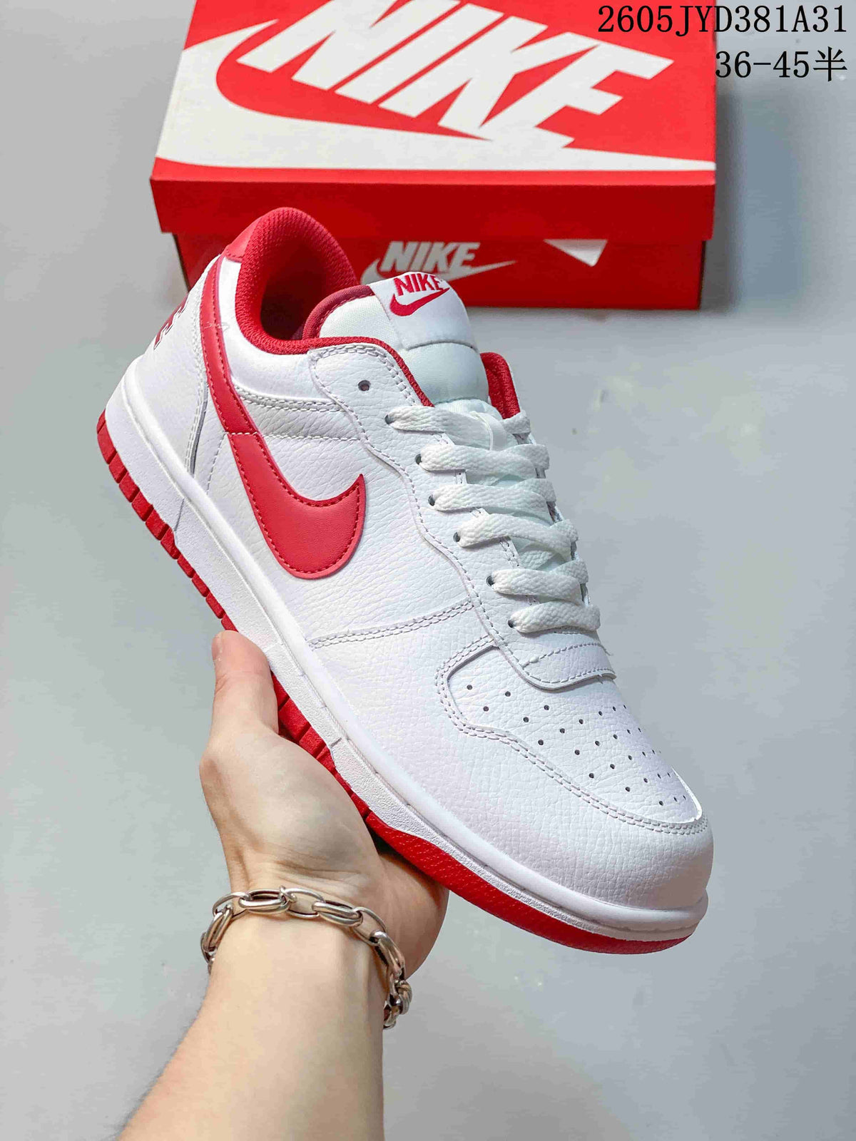 Angled view of a white low-top sneaker with red Swoosh and collar accents