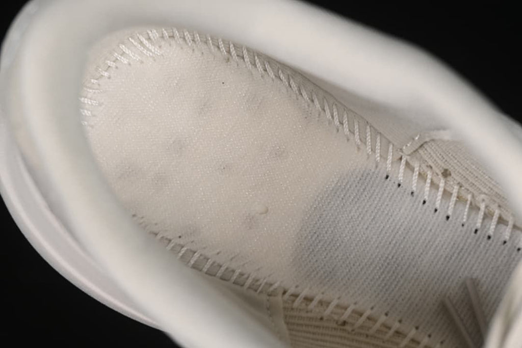 Close-up view inside the shoe, showing the lining and stitching