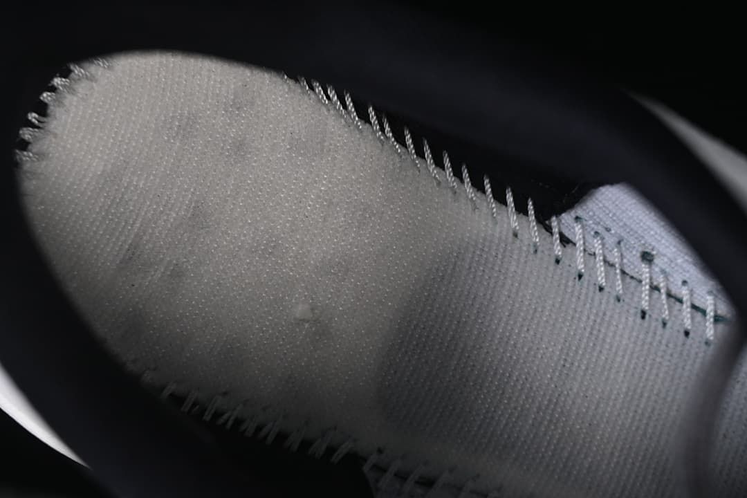 Close view inside the shoe showing the footbed and lace area.