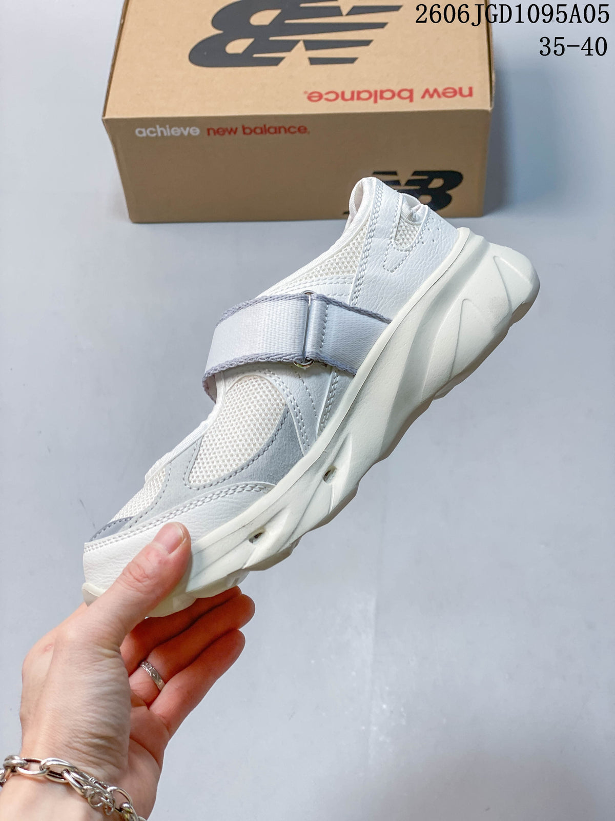 Side profile of a white New Balance Breeze Mary Jane sneaker with a broad instep strap