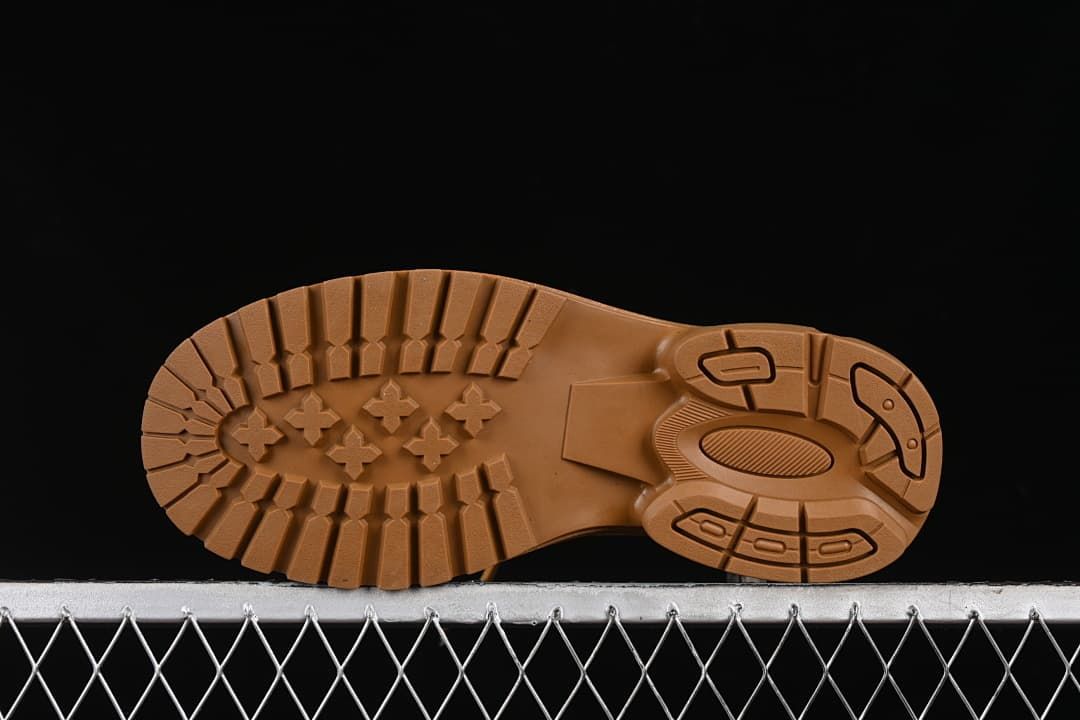 Underside view showing the lugged outsole tread