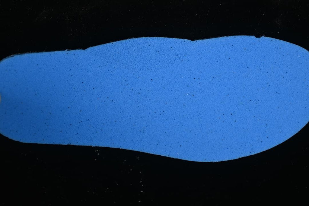 Blue insole shown against a dark background.