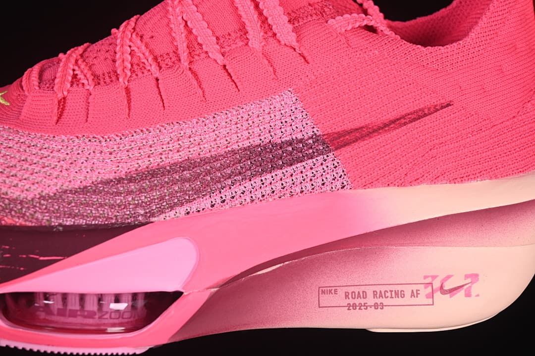 Close-up of the pink upper, dark Swoosh and sculpted midsole