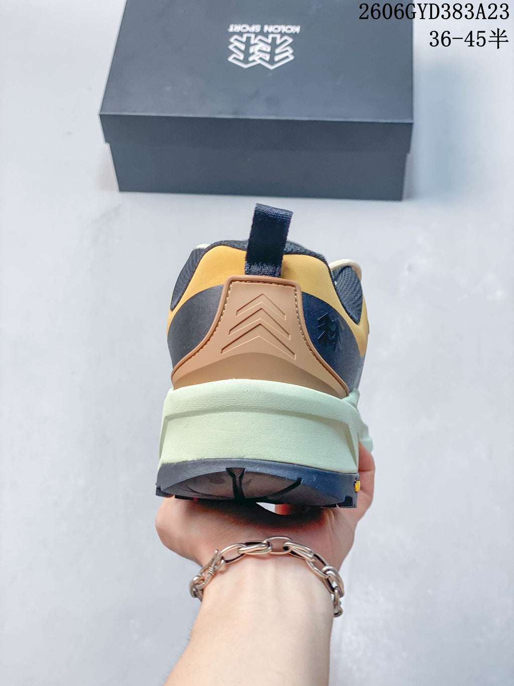 Rear view showing the heel and pale green midsole