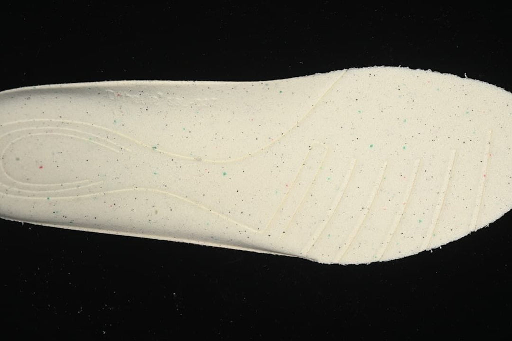 Close-up of the shoe's light-colored footbed