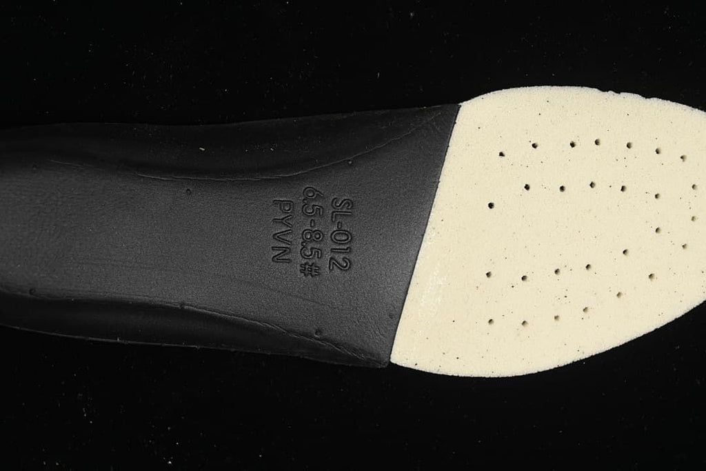 Close-up of the shoe insole showing printed markings.