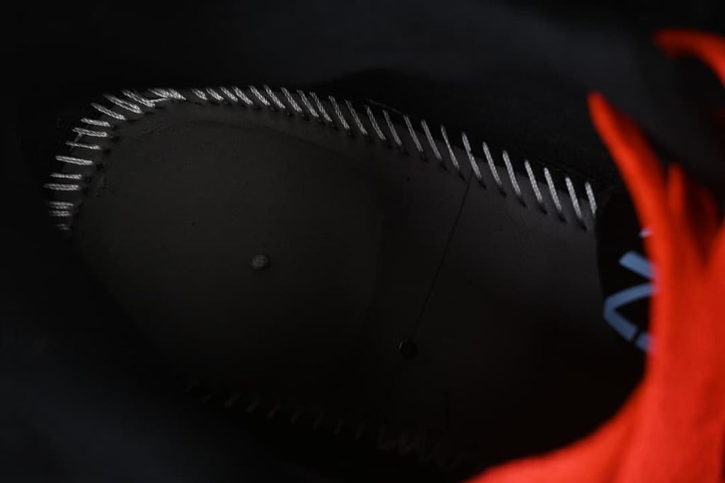 Close view of the shoe's interior construction and stitching.
