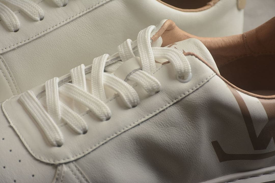 Close-up of the lace-up fastening and side logo