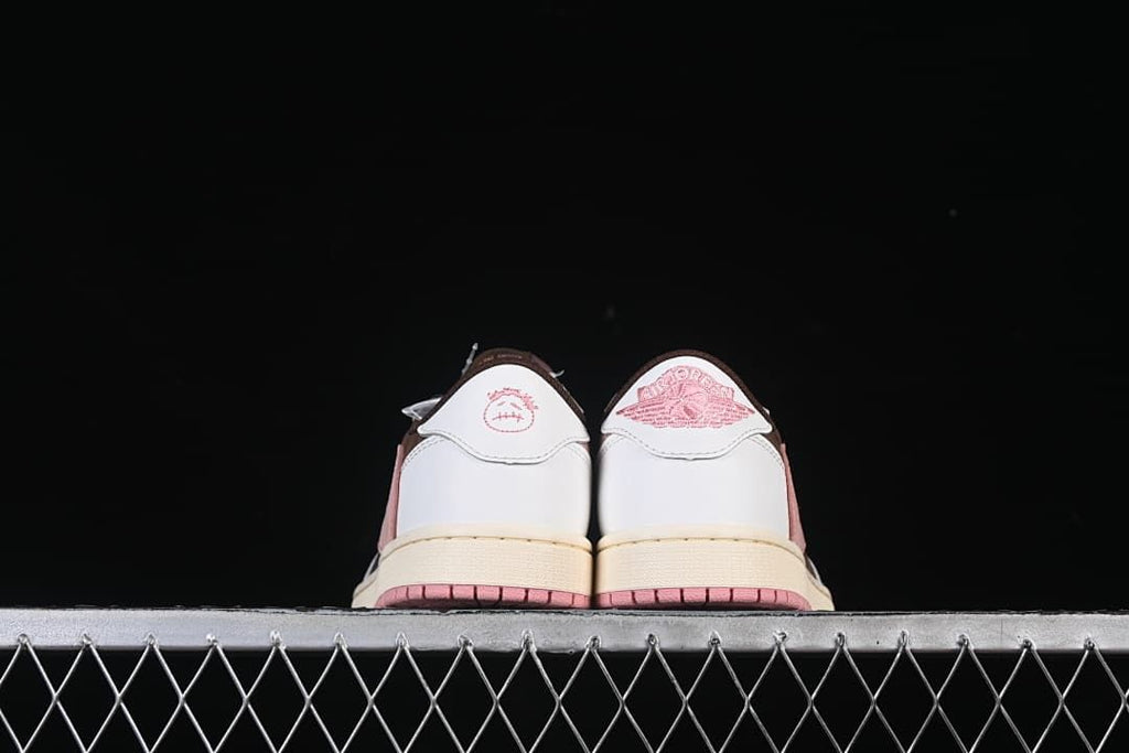 Rear view of both sneakers with contrasting heel graphics.