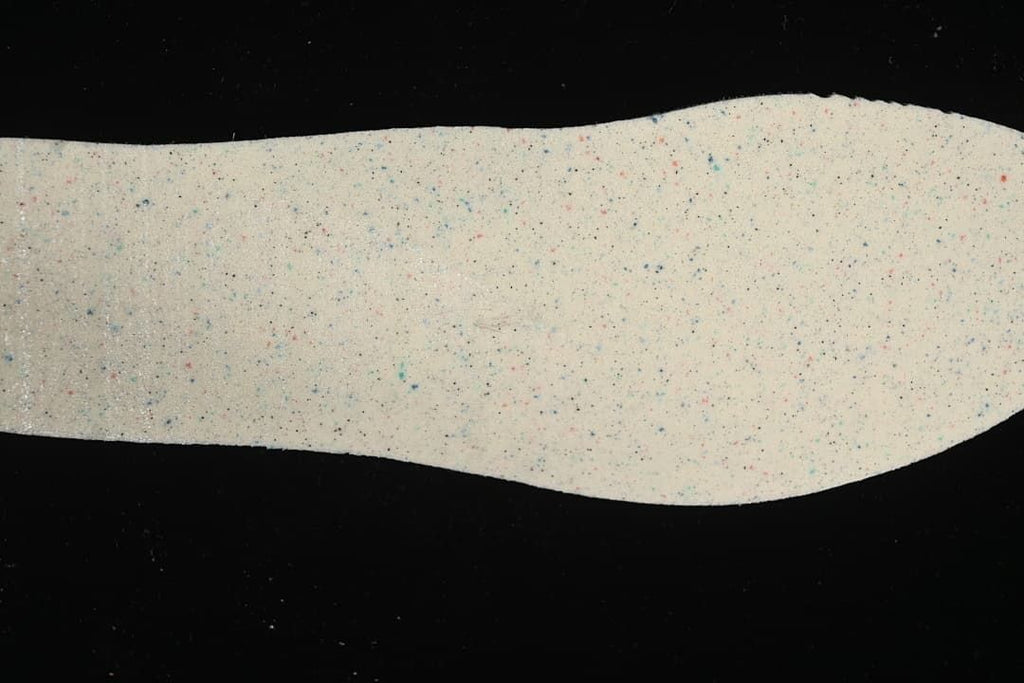 Close-up of a light insole with multicolor speckles