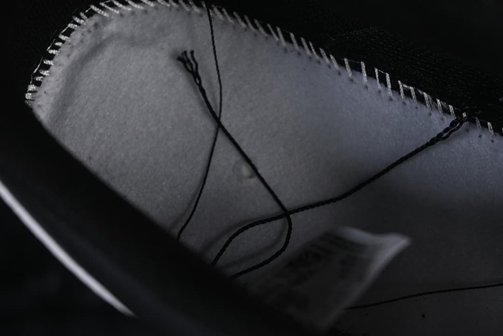 Close-up inside the sneaker showing the lining and stitching