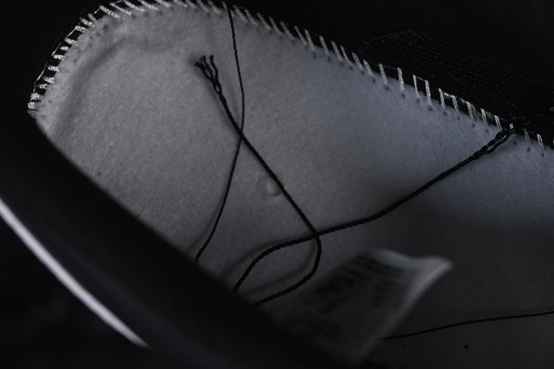 Close-up inside the sneaker showing the lining and stitching