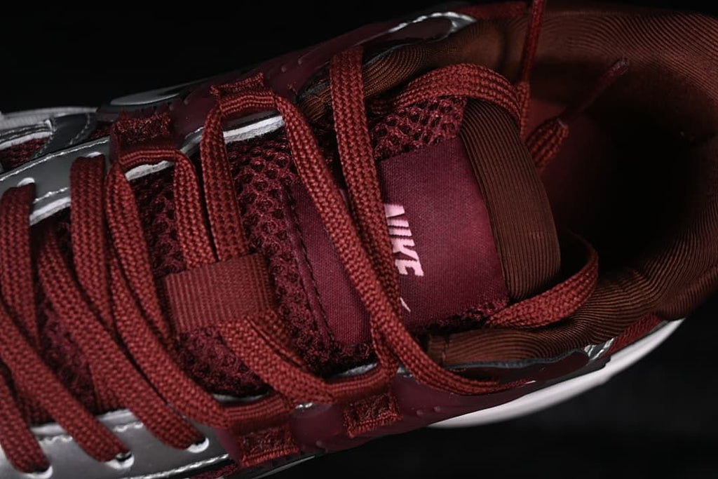 Close-up of the burgundy laces, tongue, and upper