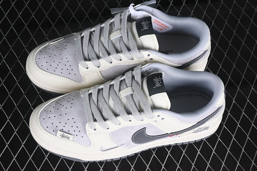 Pair of off-white and grey low-top sneakers shown from above