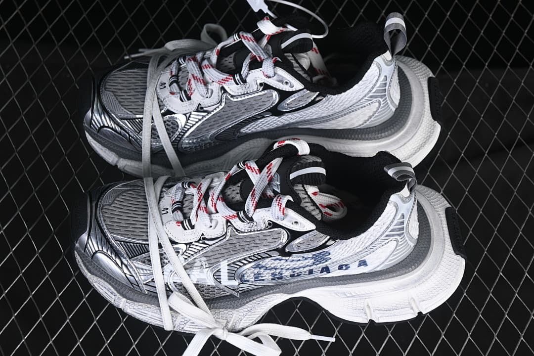 Pair of white, navy, and grey sneakers viewed from above