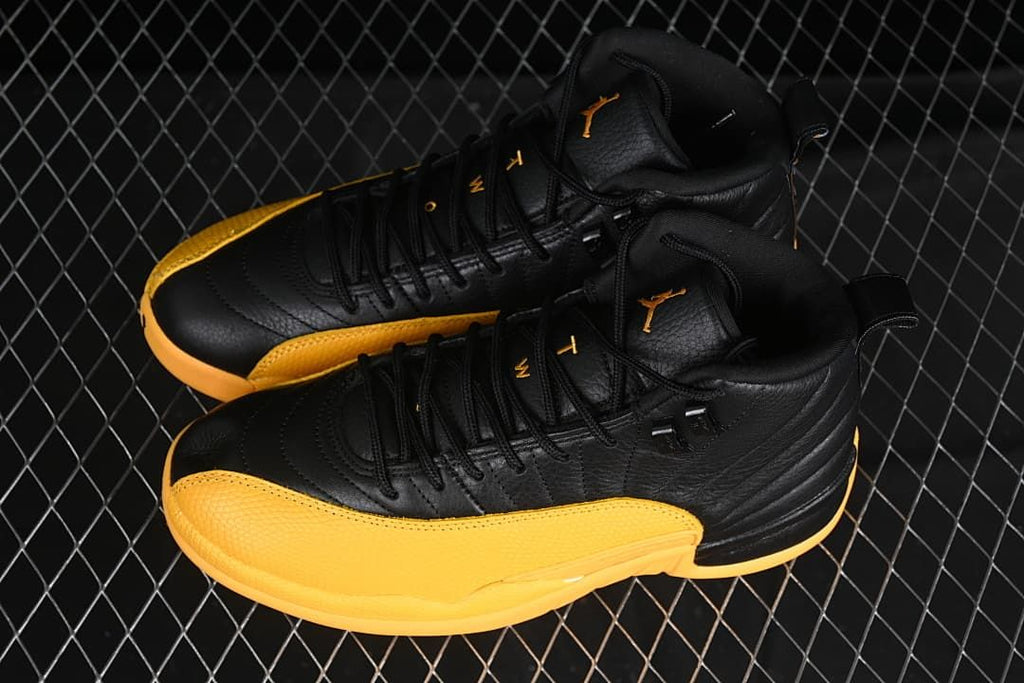Pair of black and gold high-top sneakers viewed from above