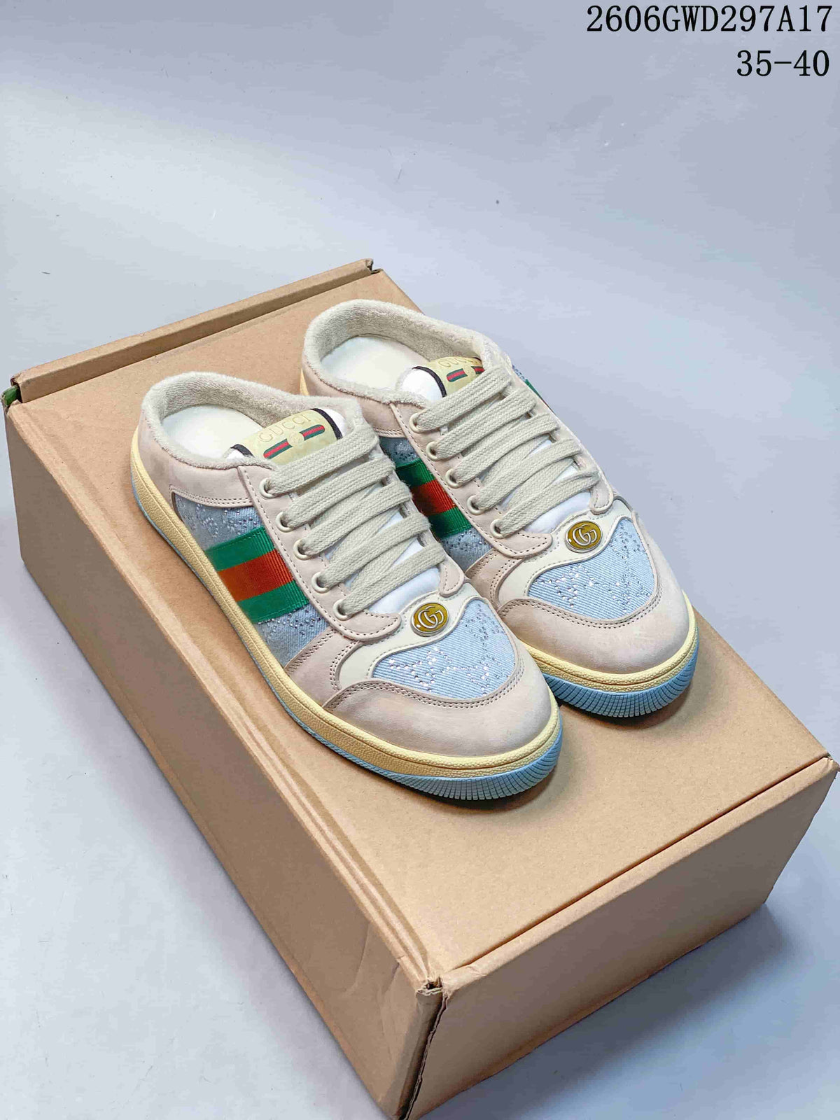Pair of beige and light blue Gucci Screener-style lace-up sneakers on a box
