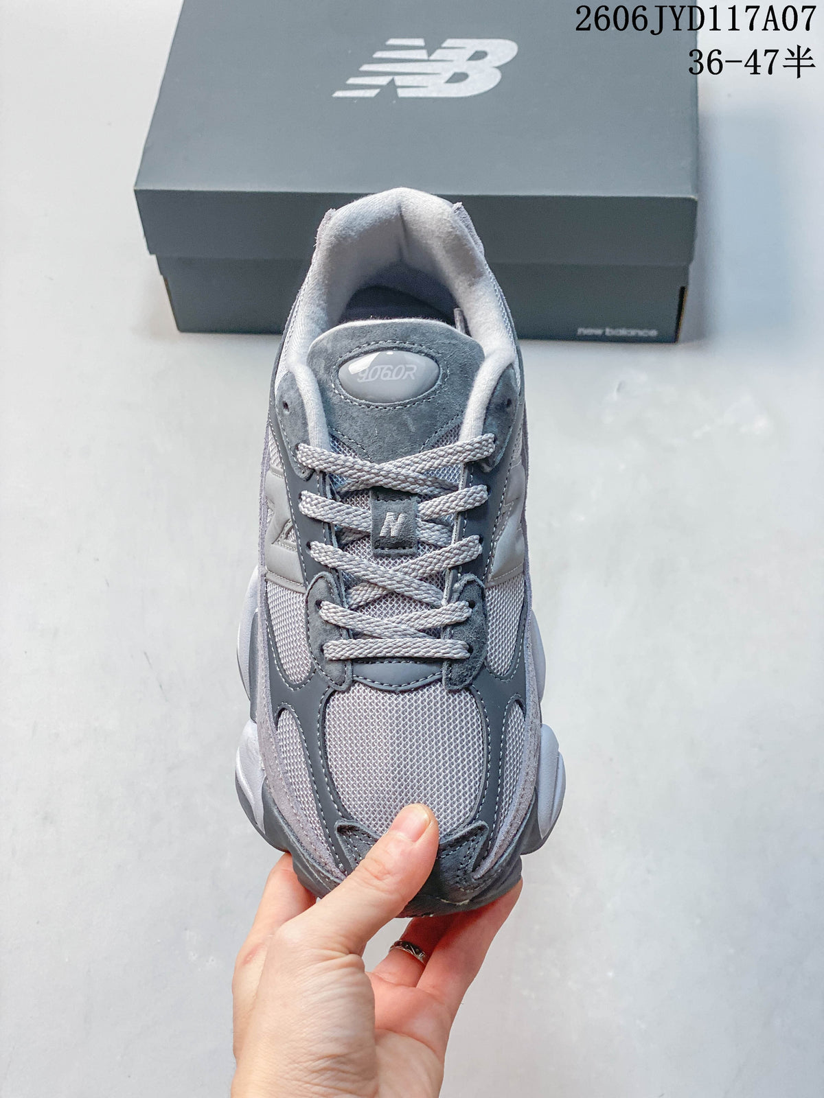Top view of a grey New Balance 9060 sneaker with laces and mesh-like panels