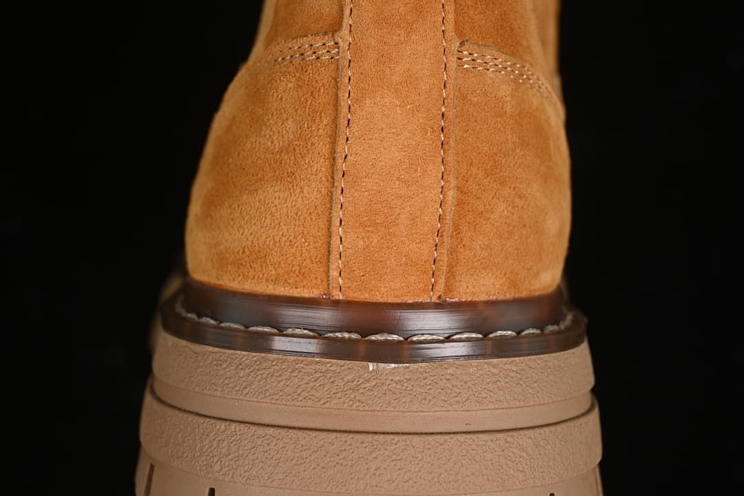 Rear close-up showing stitched upper and layered heel sole.