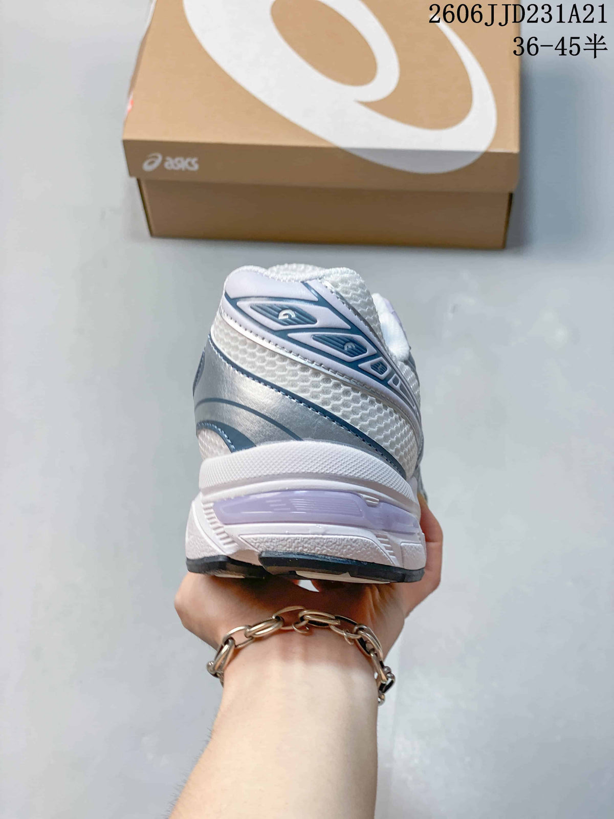 Rear view of a white ASICS GEL-1130 sneaker with silver and lavender details