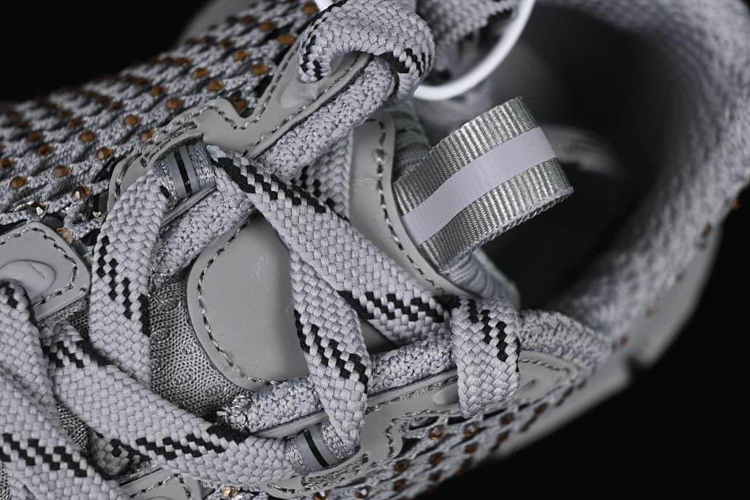 Close-up of the lace-up area, tongue, and heel pull tab.