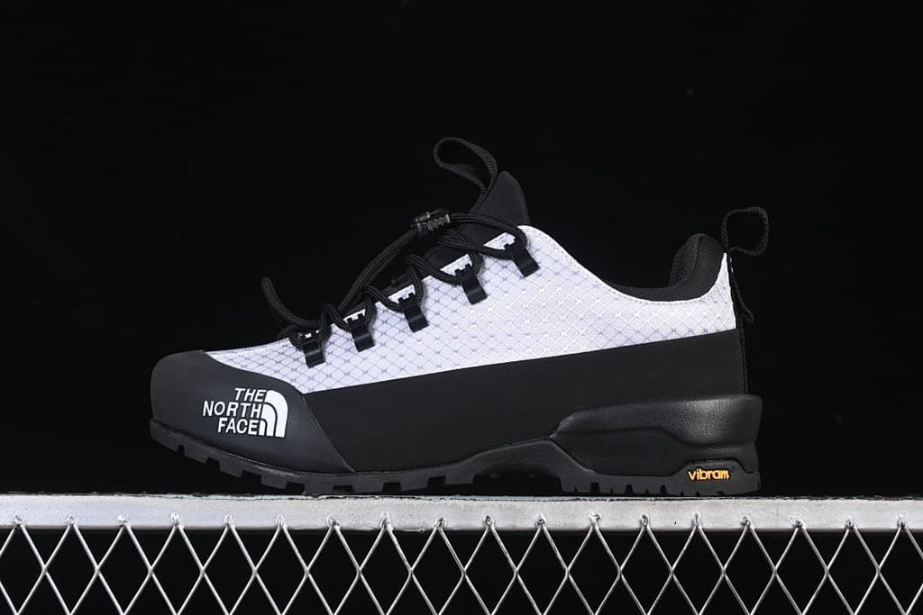 Side view of a white and black The North Face Glenclyffe Low shoe.