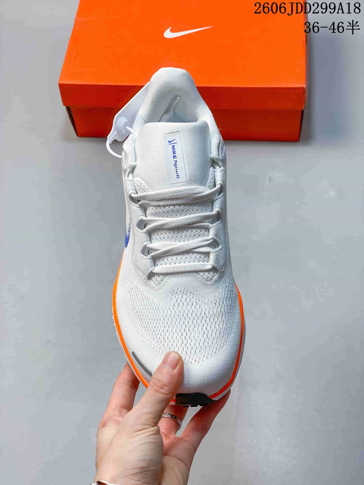 Top view of the white Nike Pegasus 41 shoe showing its laces and mesh-look upper.