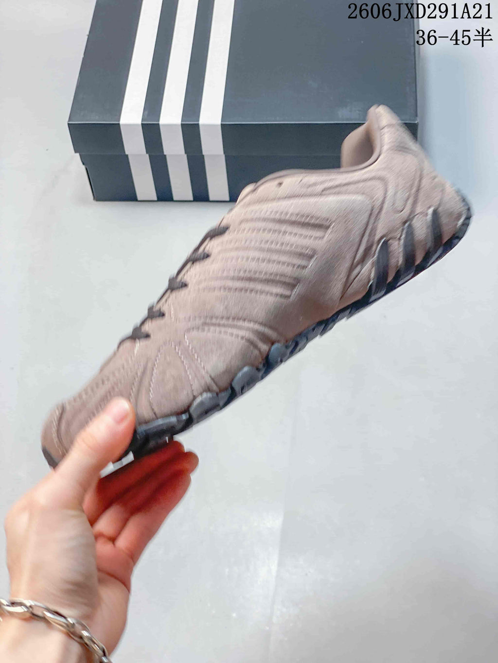 Side view of a taupe Ghost Sprint sneaker with dark laces