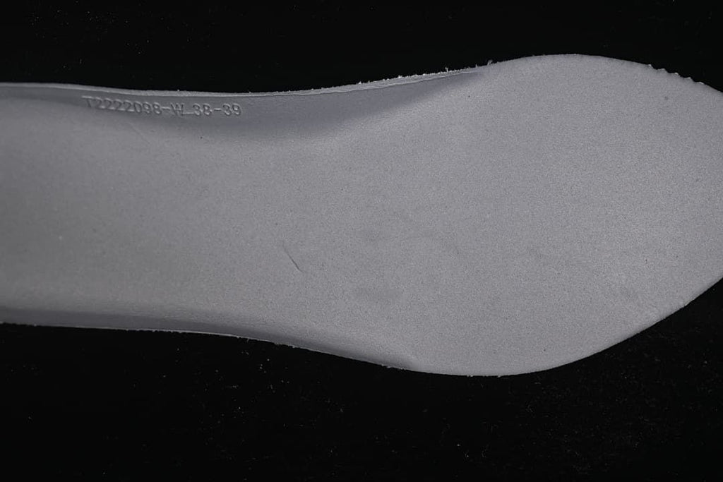 Close-up of the sneaker insole with a stamped marking