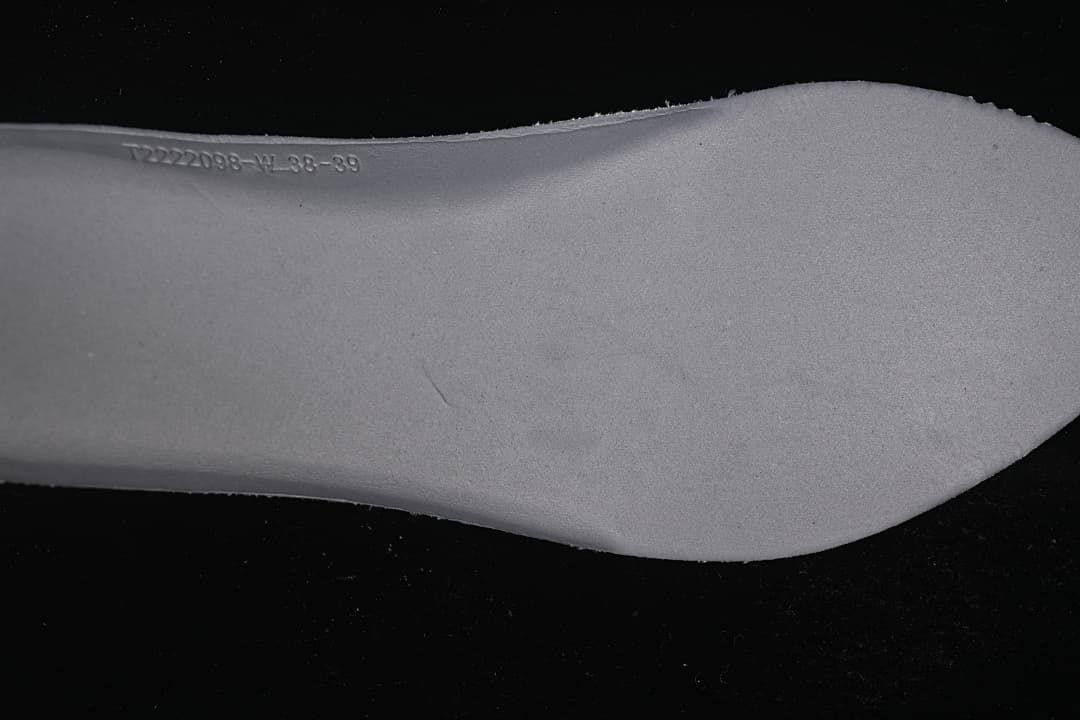 Close-up of the sneaker insole with a stamped marking