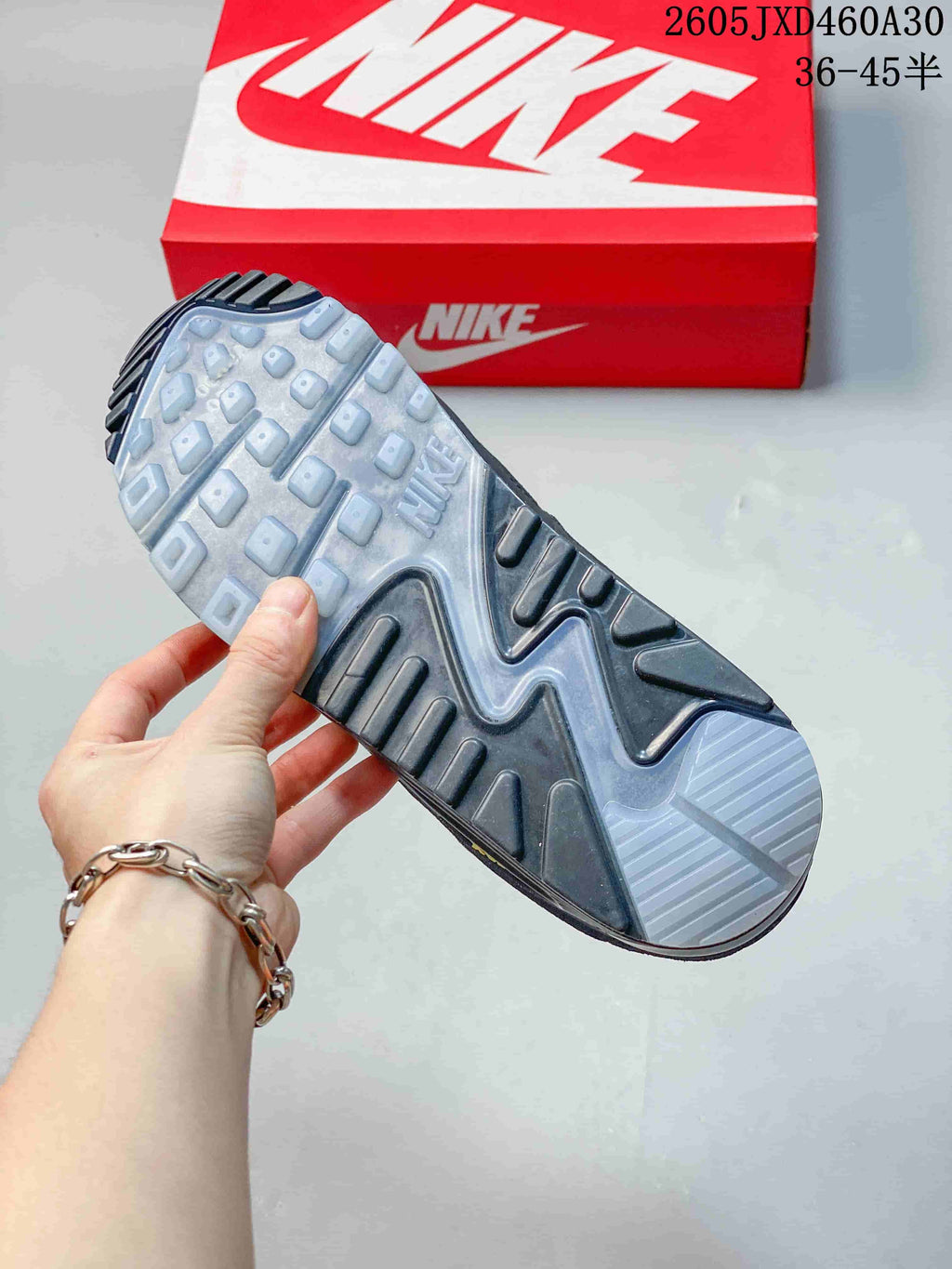 Outsole of a Nike Air Max 90 sneaker showing the tread pattern