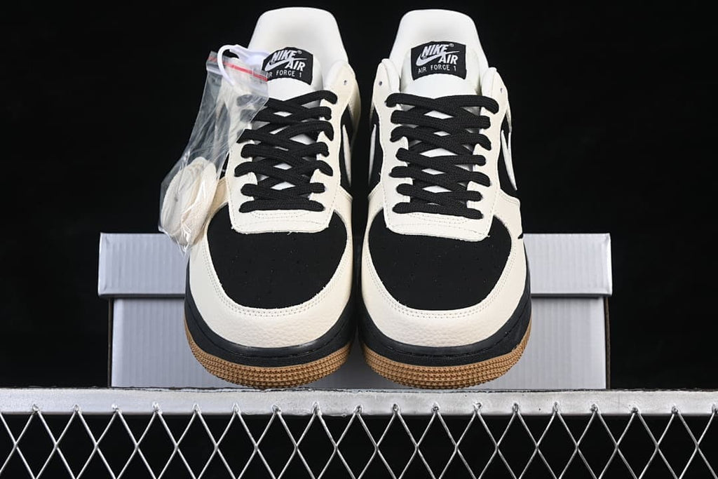 Front view of the pair with black toe panels, sail overlays, and gum outsoles