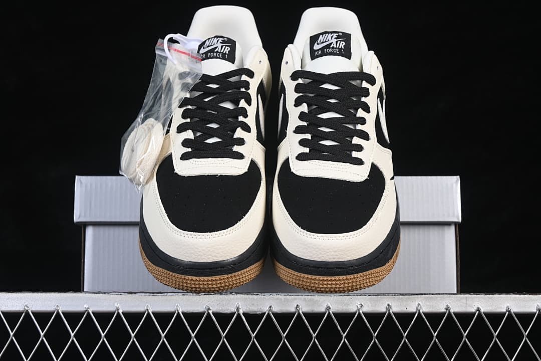 Front view of the pair with black toe panels, sail overlays, and gum outsoles