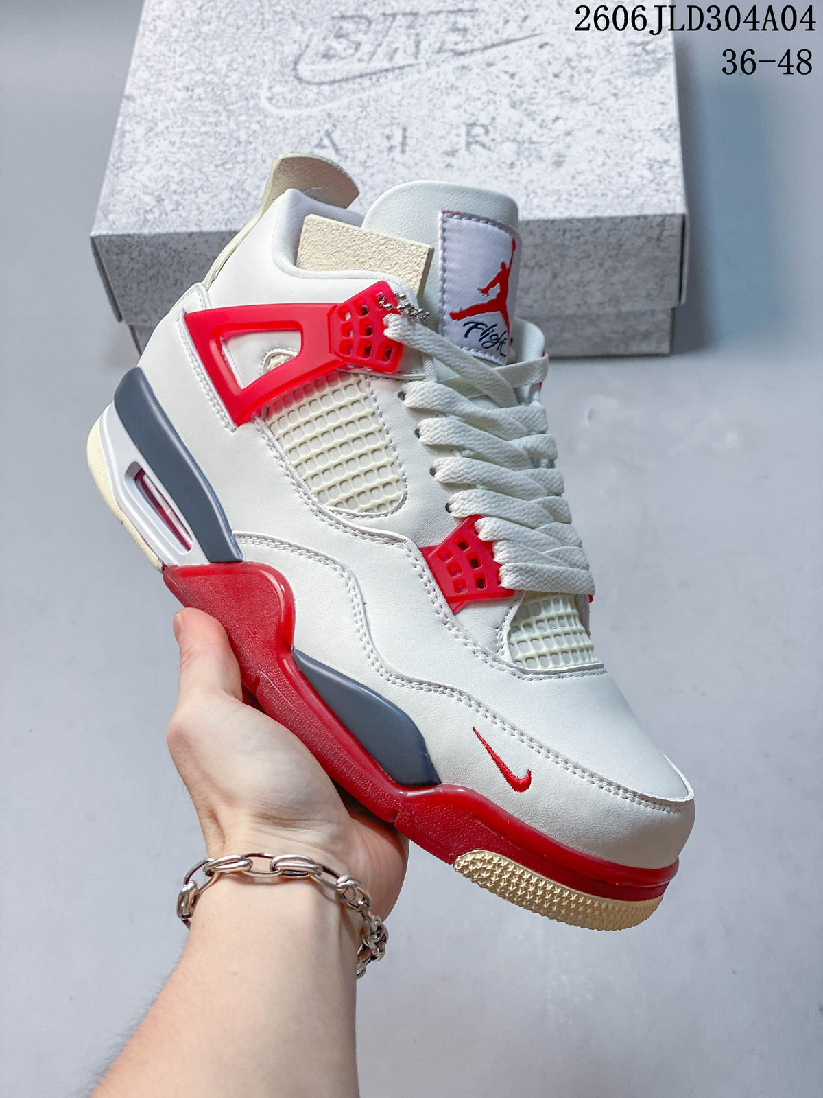 Angled side view of the white sneaker with red eyelets and grey midsole details