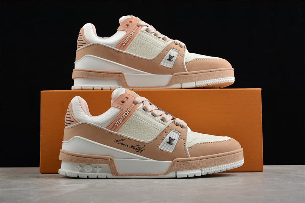 Pair of sneakers displayed on an orange shoebox