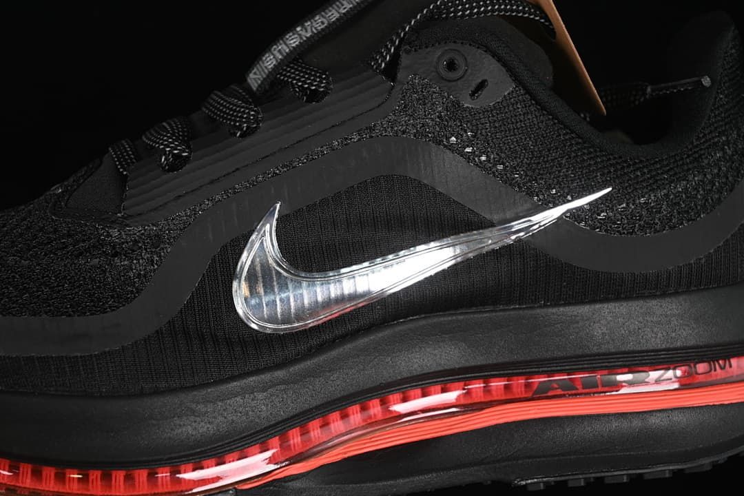 Close-up of the silver Swoosh, mesh upper and coral-tinted sole unit