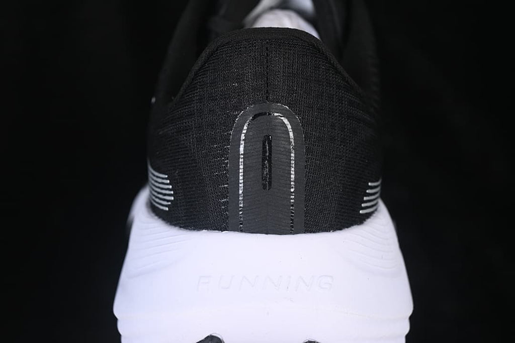 Rear view showing the black heel and white midsole