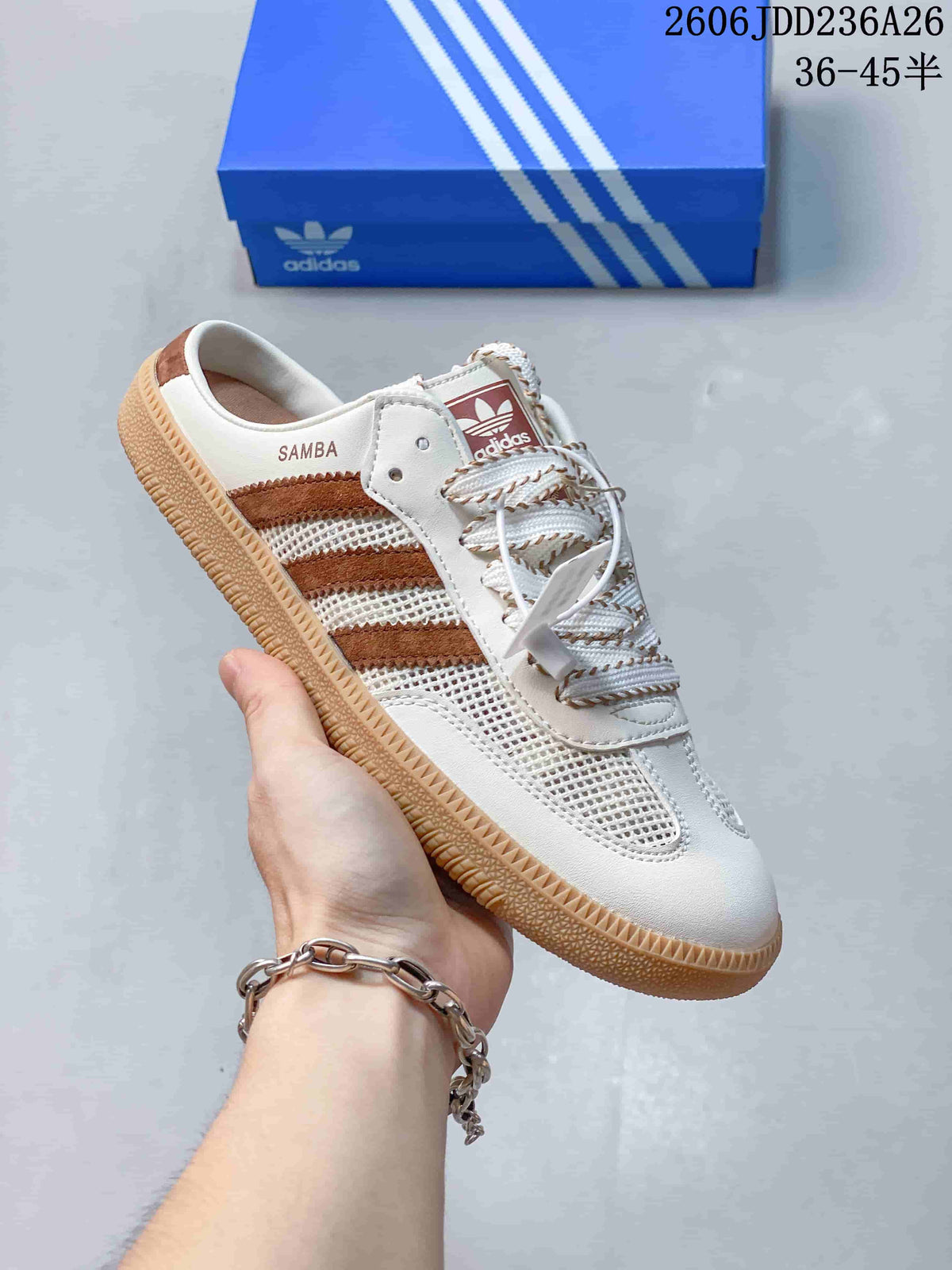 Side view of a cream Samba-style sneaker with brown stripes, mesh panels, and an open heel
