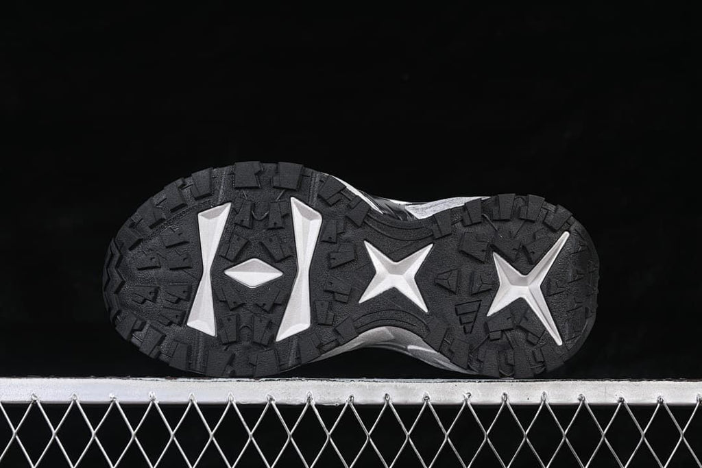 Underside view showing the patterned black outsole