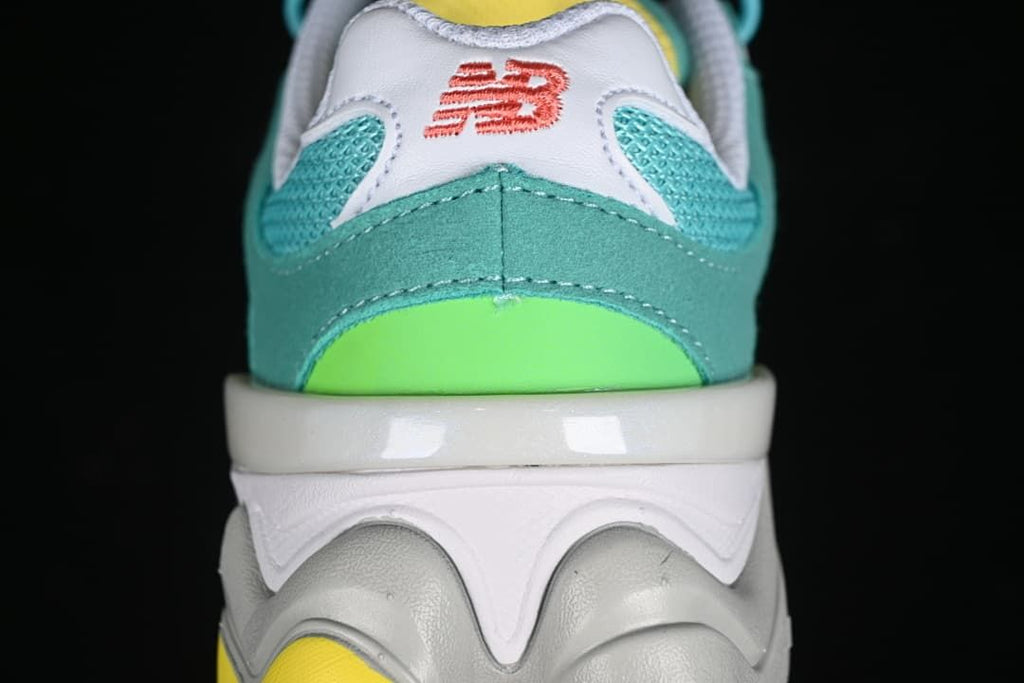 Rear view of teal and lime sneaker with white and gray sole