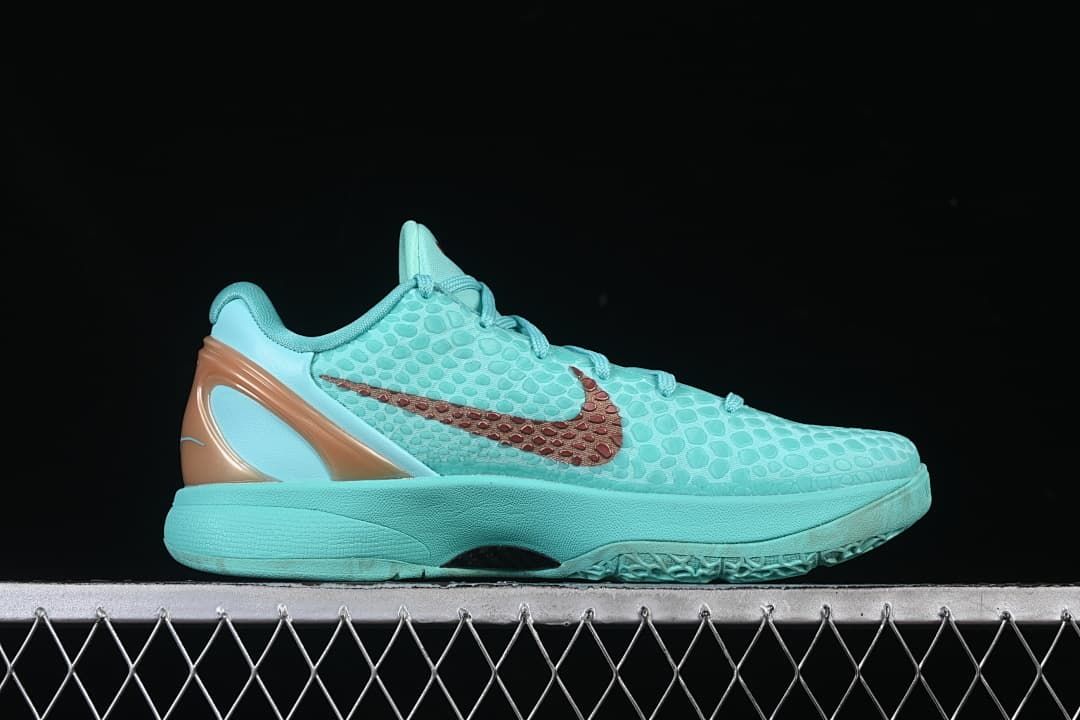 Side profile showing the turquoise upper, copper-toned logo and heel accent.