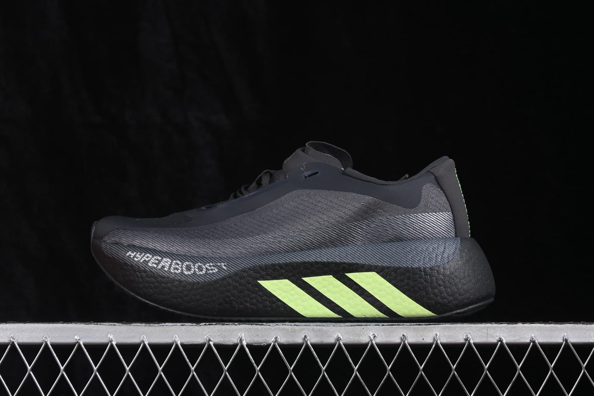Side profile of black Adidas HyperBoost Edge M shoes with fluorescent green three-stripe detailing.
