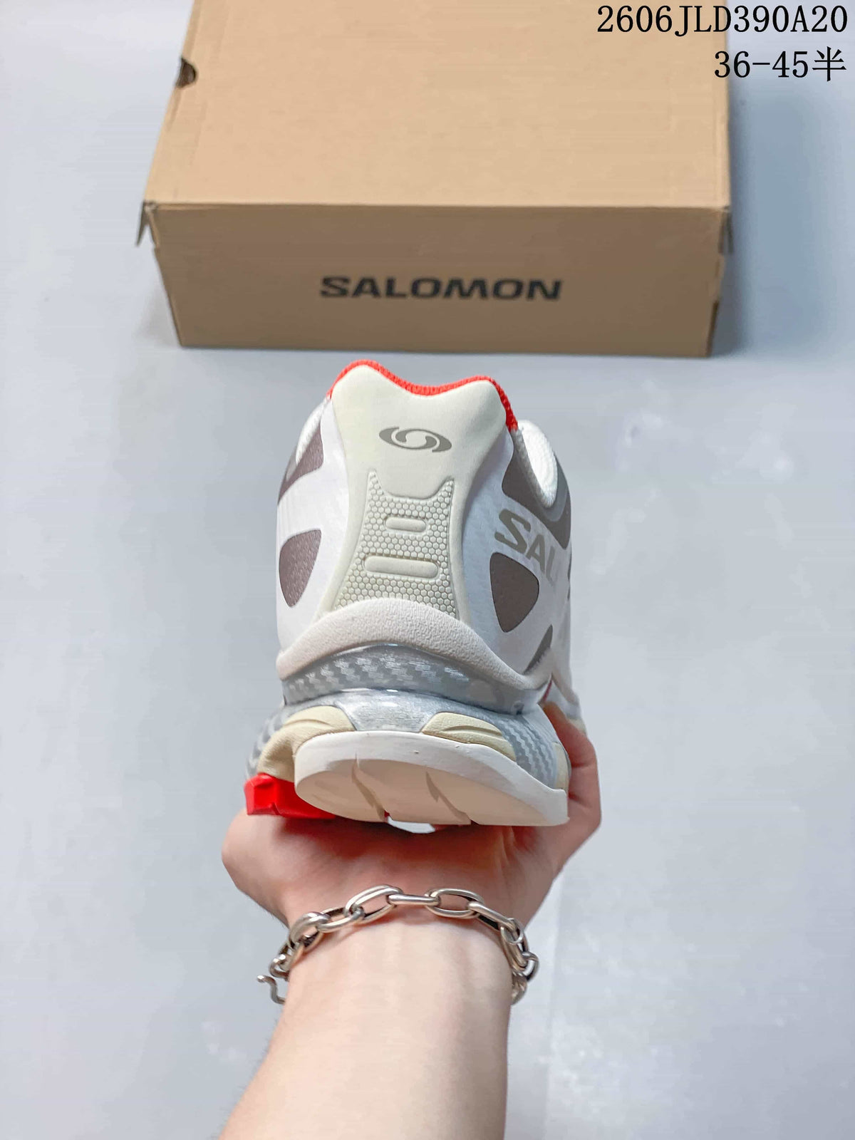 Rear view of the shoe showing the heel design and red collar accent.
