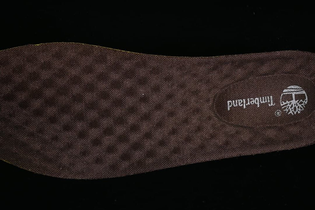 Close-up of the dark patterned insole with Timberland branding