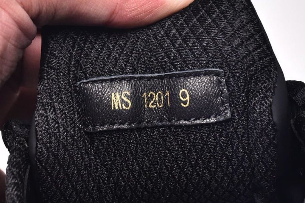 Close-up of an interior label marked with size 9