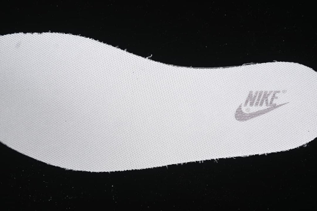 Close-up of a textured shoe insole with a Nike mark