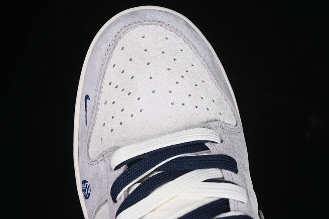 Top-down close-up of the perforated toe and laces.