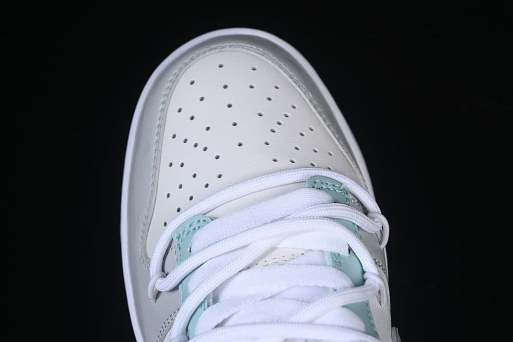 Top-down close-up of the perforated toe and laces